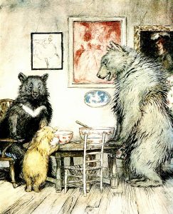 Et bilde i farger. En familie på tre bjørner spiser sammen. Hver bjørn har egen stol og eget fat.